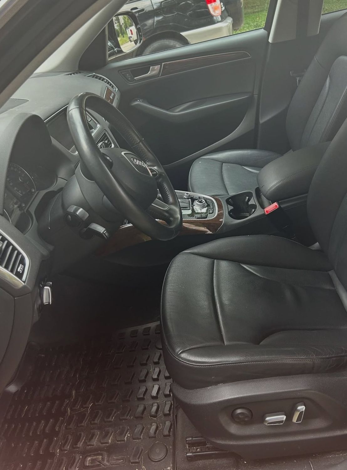 Audi Q5 driver seat and footwell before detailing